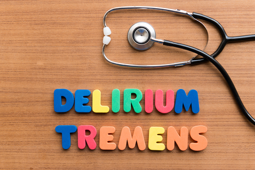 letters next to stethoscope saying delirium tremens